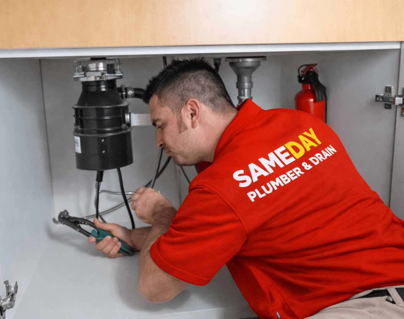 Same Day Plumber & Drain technician performing professional drain cleaning in Birmingham, MI using advanced equipment and providing fast, reliable local service.