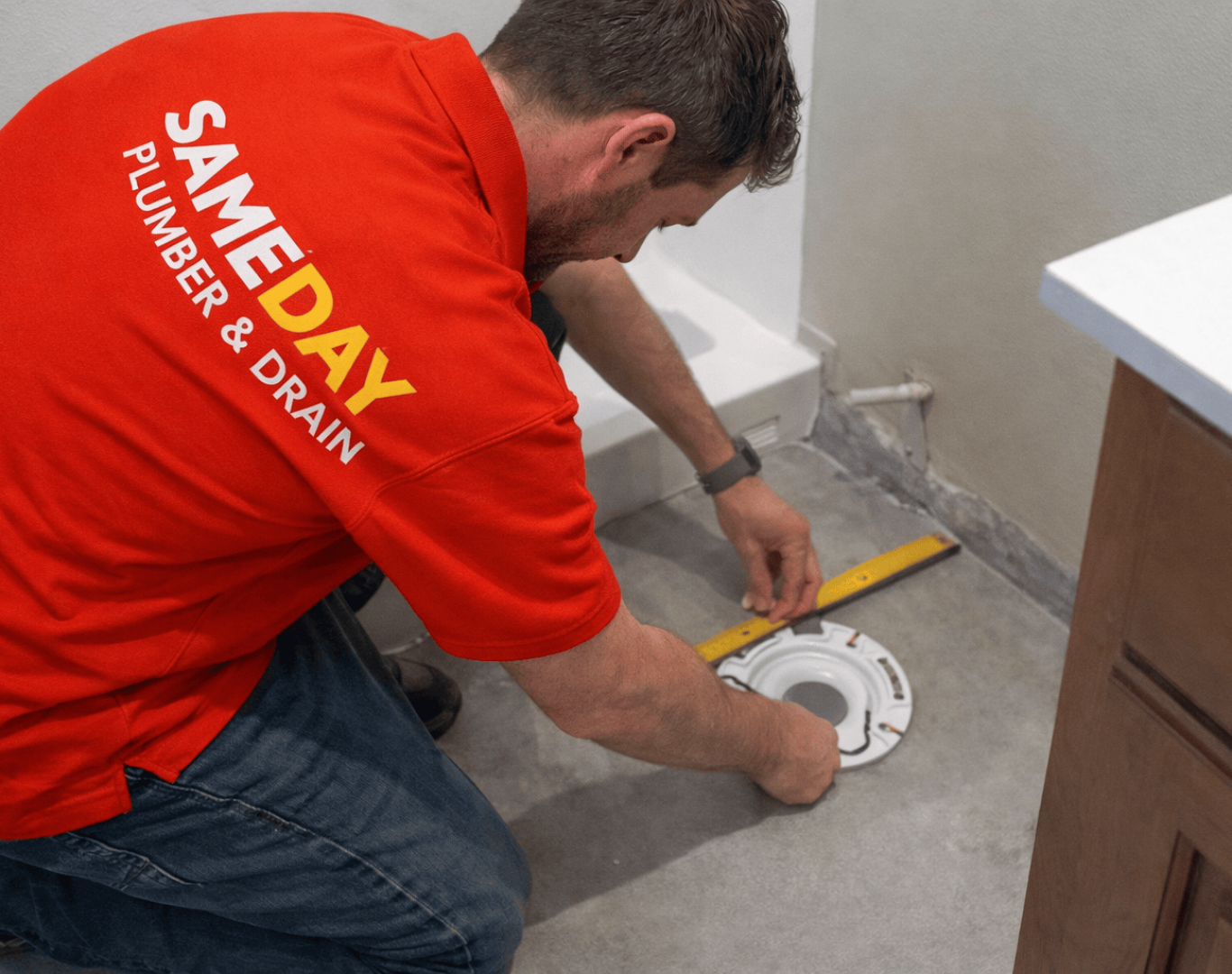 Same Day Plumber & Drain technician performing professional plumbing services in Oakland County, MI using modern tools for fast, reliable local repairs.